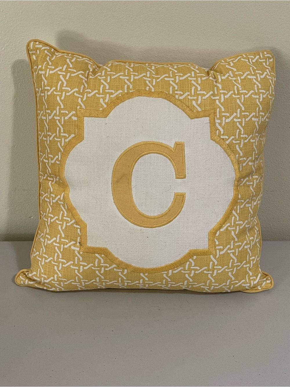 C initial yellow throw pillow